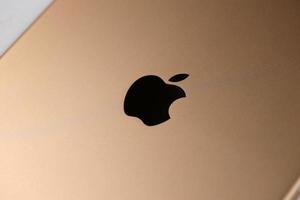 KHARKIV, UKRAINE - JANUARY 27, 2021 Brand new Apple iPad golden body surface with company logo. Apple Inc. is an American technology company photo