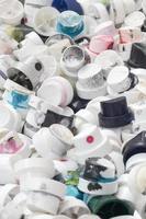 A pattern of many used and soiled nozzles from spray cans with aerosol paint. Background texture of the street art of drawing graffiti on the walls photo