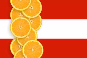 Austria flag and citrus fruit slices vertical row photo