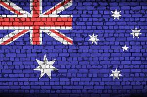 Australia flag is painted onto an old brick wall photo