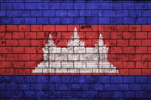 Cambodia flag is painted onto an old brick wall photo