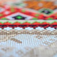 Traditional Ukrainian folk art knitted embroidery pattern on textile fabric photo