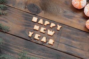 Tangerines, cracker text and fir branches with copy space photo