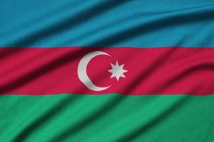 Azerbaijan flag  is depicted on a sports cloth fabric with many folds. Sport team banner photo