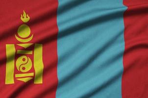 Mongolia flag  is depicted on a sports cloth fabric with many folds. Sport team banner photo