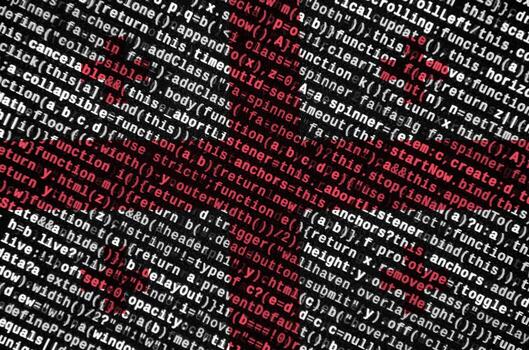 Georgia flag  is depicted on the screen with the program code. The concept of modern technology and site development photo