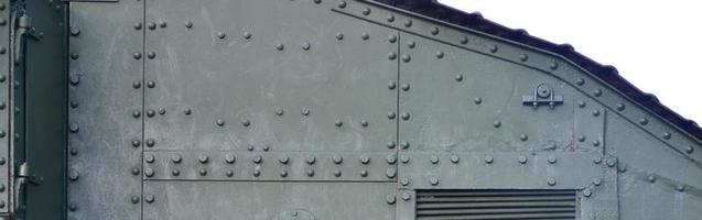 Abstract green industrial metal textured background with rivets and bolts photo