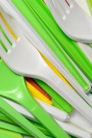 Pile of bright yellow, green and white used plastic kitchenware appliances photo