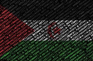 Western Sahara flag  is depicted on the screen with the program code. The concept of modern technology and site development photo