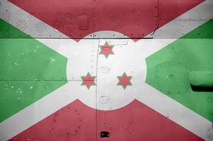 Burundi flag depicted on side part of military armored helicopter closeup. Army forces aircraft conceptual background photo