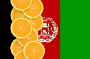 Afghanistan flag and citrus fruit slices vertical row photo