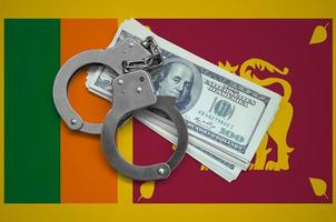 Sri Lanka flag  with handcuffs and a bundle of dollars. Currency corruption in the country. Financial crimes photo