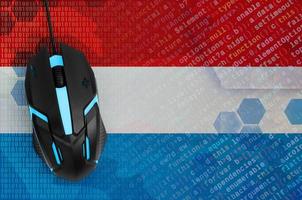 Luxembourg flag  and computer mouse. Digital threat, illegal actions on the Internet photo
