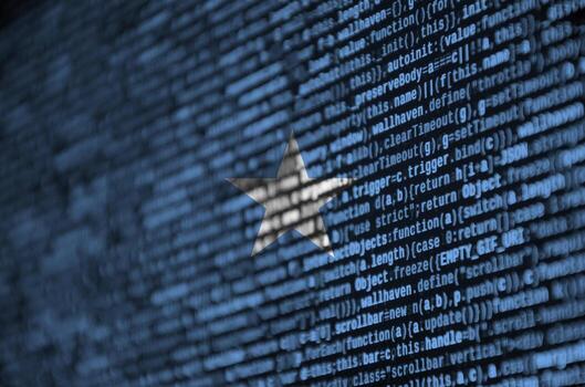 Somalia flag  is depicted on the screen with the program code. The concept of modern technology and site development photo
