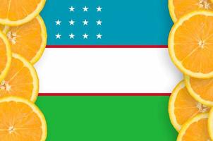 Uzbekistan flag  in citrus fruit slices vertical frame photo