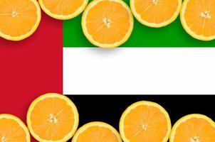 United Arab Emirates flag  in citrus fruit slices horizontal frame photo