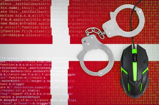 Denmark flag  and handcuffed computer mouse. Combating computer crime, hackers and piracy photo