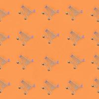 Shopping addiction, shopping lover or shopaholic concept. Many small empty shopping carts perform a pattern on a pastel colored paper background. Flat lay composition, top view photo