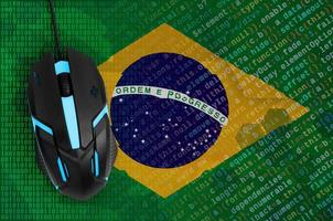 Brazil flag  and computer mouse. Digital threat, illegal actions on the Internet photo