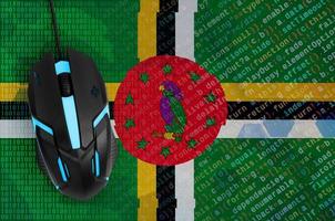 Dominica flag  and computer mouse. Digital threat, illegal actions on the Internet photo