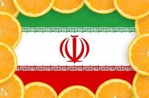 Iran flag  in fresh citrus fruit slices frame photo