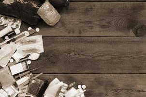 A lot of narcotic substances and devices for the preparation of drugs lie on an old wooden table photo