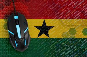 Ghana flag  and computer mouse. Digital threat, illegal actions on the Internet photo