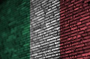Italy flag  is depicted on the screen with the program code. The concept of modern technology and site development photo
