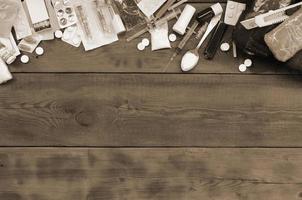 A lot of narcotic substances and devices for the preparation of drugs lie on an old wooden table photo