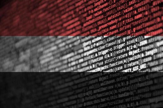 Yemen flag  is depicted on the screen with the program code. The concept of modern technology and site development photo