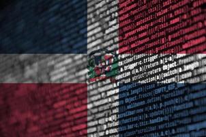 Dominican Republic flag  is depicted on the screen with the program code. The concept of modern technology and site development photo