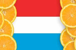 Luxembourg flag  in citrus fruit slices vertical frame photo