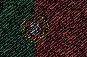 Portugal flag  is depicted on the screen with the program code. The concept of modern technology and site development photo