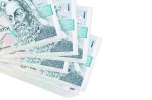 100 Czech korun bills lies in small bunch or pack isolated on white. Mockup with copy space. Business and currency exchange photo