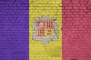 Andorra flag is painted onto an old brick wall photo