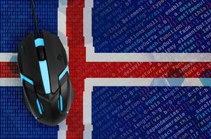 Iceland flag  and computer mouse. Digital threat, illegal actions on the Internet photo