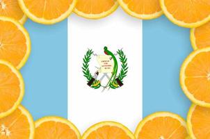 Guatemala flag  in fresh citrus fruit slices frame photo