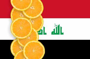 Iraq flag and citrus fruit slices vertical row photo