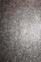 Pattern of 12 gauge cartridges for shotgun bullets. Shells for hunting rifle close up. Backdrop for shooting range or ammunition trade concepts photo