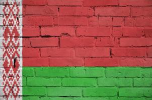 Belarus flag is painted onto an old brick wall photo