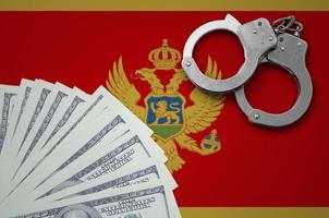 Montenegro flag  with handcuffs and a bundle of dollars. The concept of illegal banking operations in US currency photo