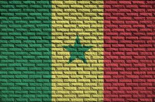 Senegal flag is painted onto an old brick wall photo