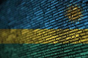 Rwanda flag  is depicted on the screen with the program code. The concept of modern technology and site development photo