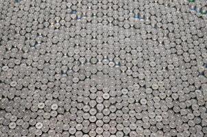 Pattern of 12 gauge cartridges for shotgun bullets. Shells for hunting rifle close up. Backdrop for shooting range or ammunition trade concepts photo
