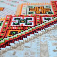 Traditional Ukrainian folk art knitted embroidery pattern on textile fabric photo