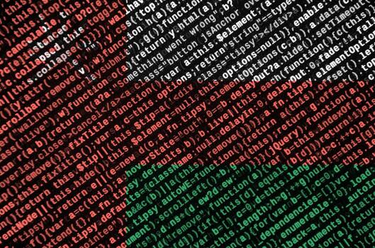 Oman flag  is depicted on the screen with the program code. The concept of modern technology and site development photo
