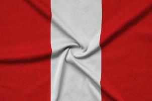 Peru flag  is depicted on a sports cloth fabric with many folds. Sport team banner photo