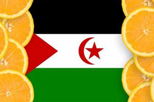 Western Sahara flag  in citrus fruit slices vertical frame photo