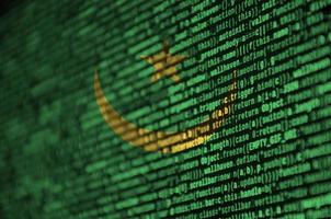 Mauritania flag  is depicted on the screen with the program code. The concept of modern technology and site development photo