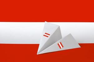 Austria flag depicted on paper origami airplane. Handmade arts concept photo